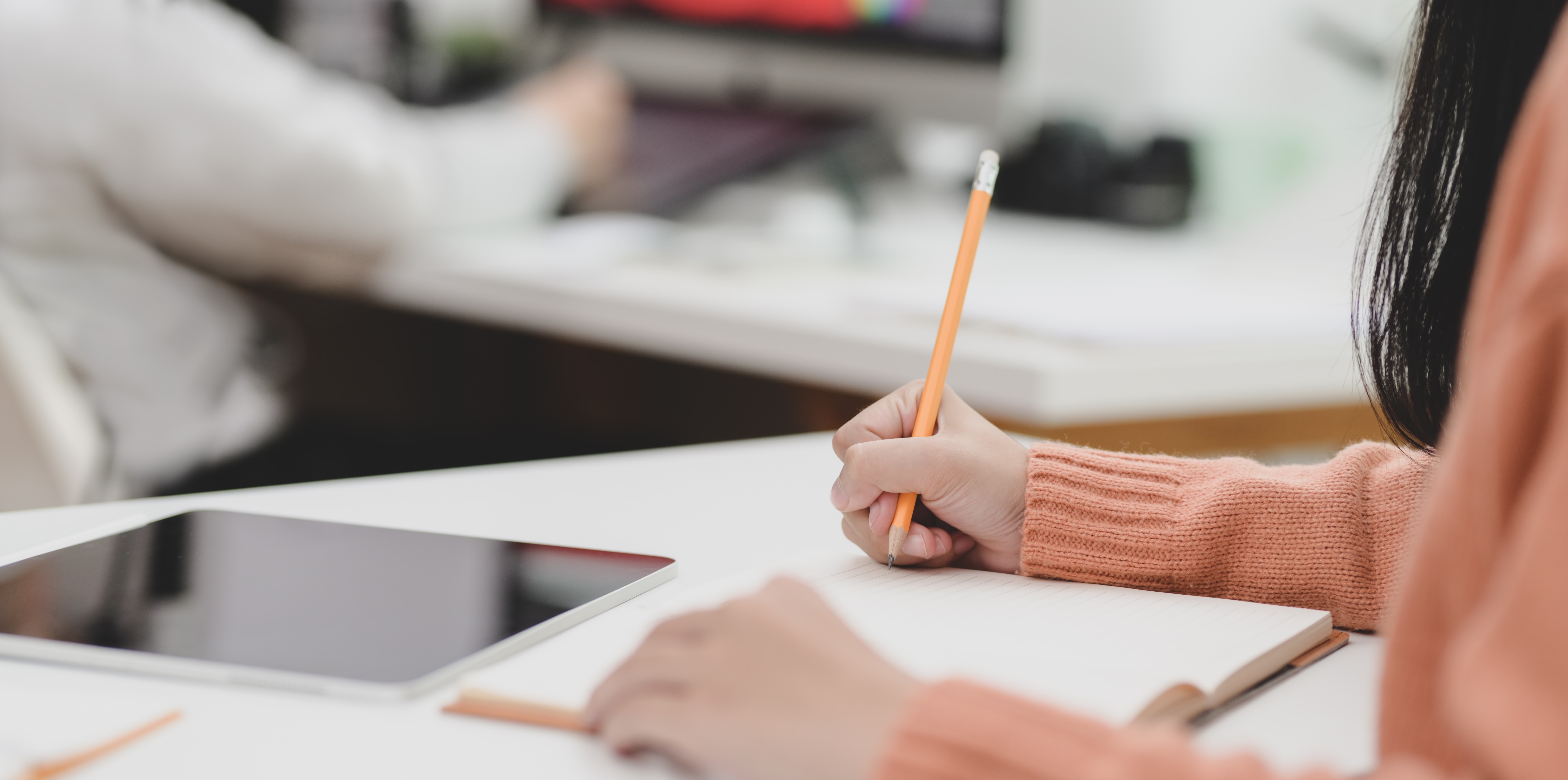 person holding pencil on white paper 3751551